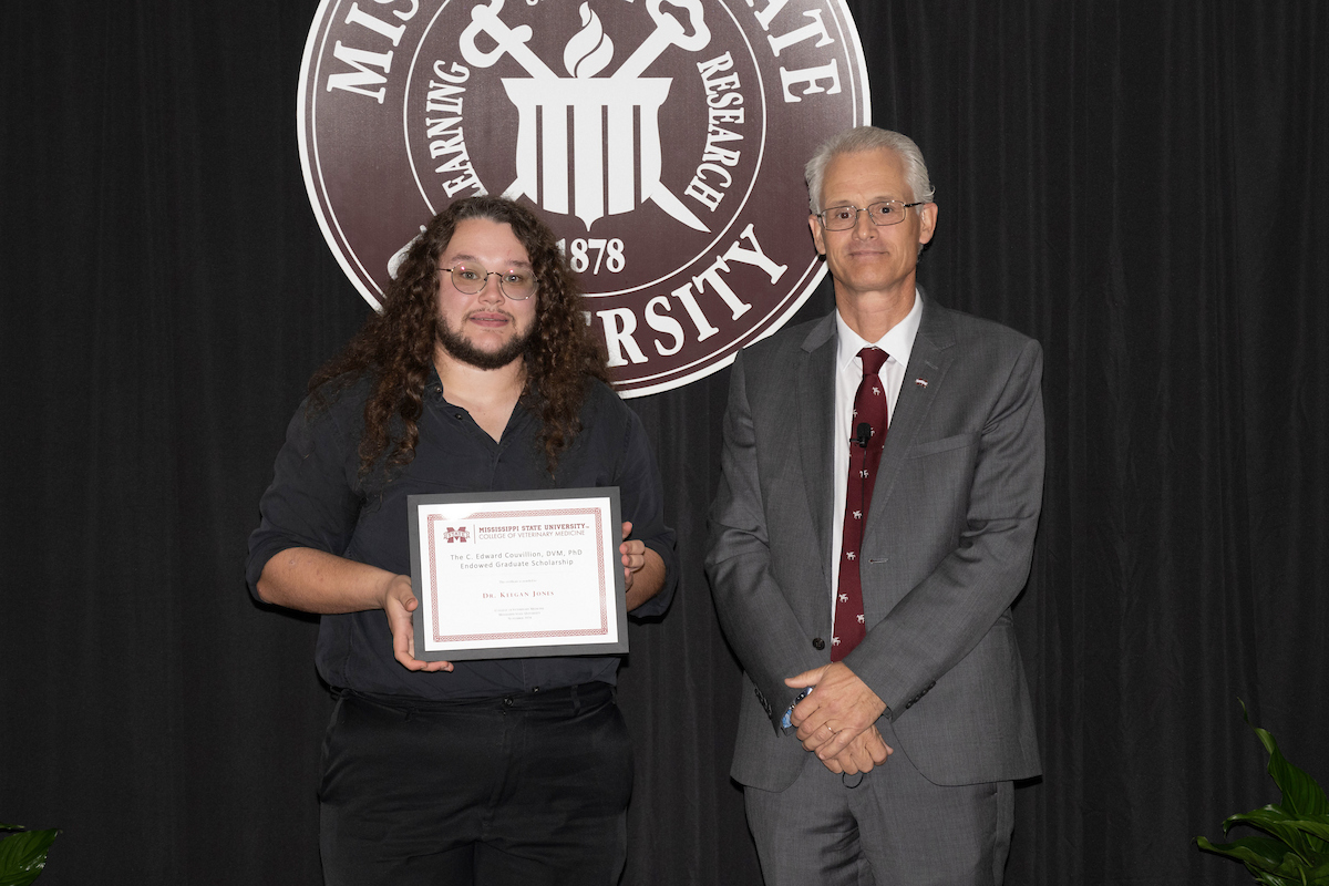 Dr. Keegan Jones is presented with the Couvillion Scholarship by Dr. Nicholas Frank