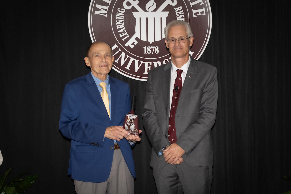 Dr. Lee Tyner receives the College of Veterinary Medicine E. Wynn Jones Award for Exceptional Service from Dr. Nicholas Frank.